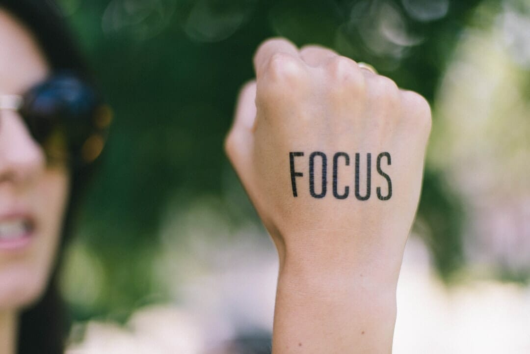 focus written on a woman's hand