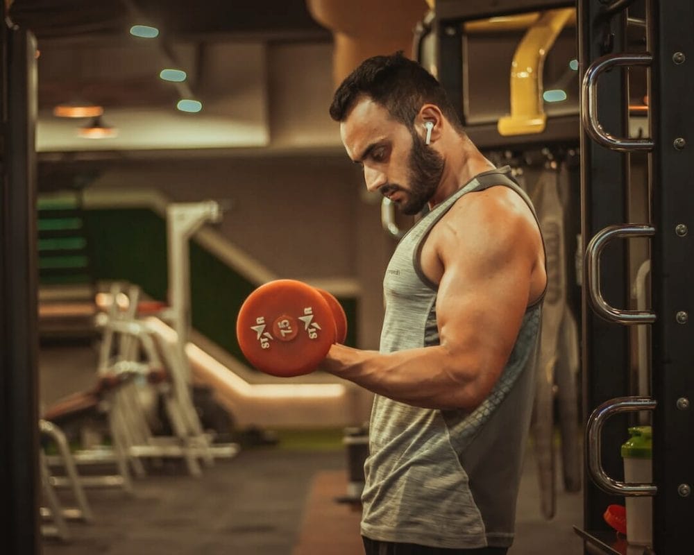 tabata-workout-man man with dumbbell in a Tabata workout